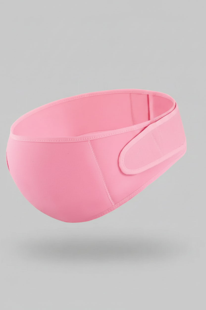 Pink sleep mask on a gray background