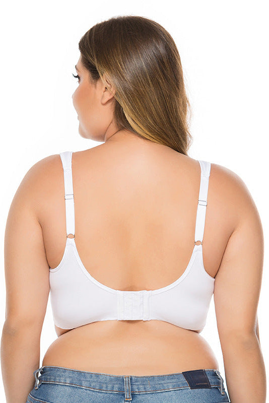 Woman wearing a white bra on a white background