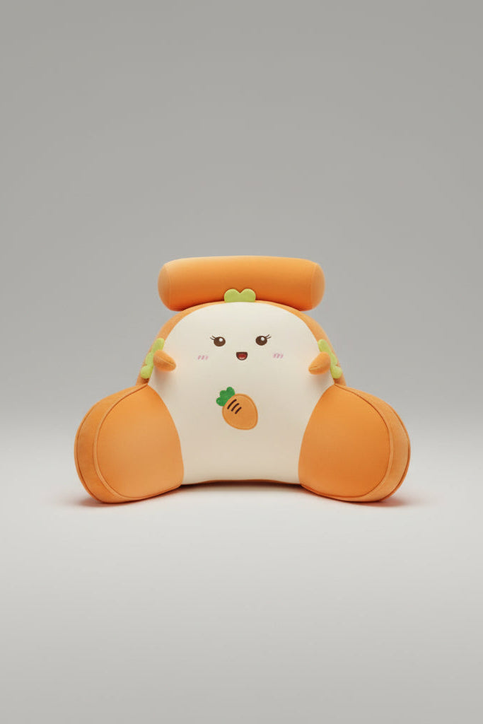 Plush carrot-shaped pillow with a face on a wooden surface.