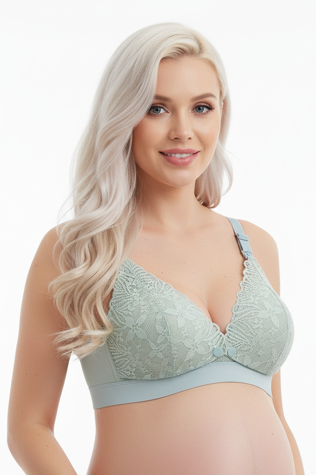 Pregnant woman wearing a light blue maternity bra on a white background
