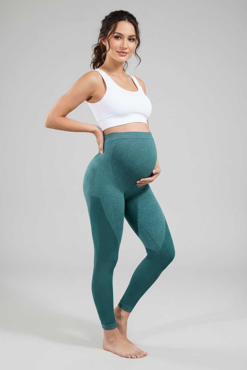 Teal leggings worn by a person on a gray background