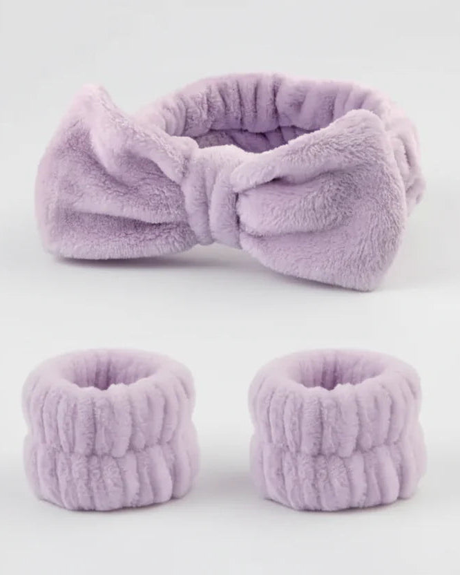Set of lavender fuzzy headband and matching scrunchies on a white background
