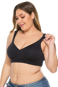 Woman wearing a black bralette on a white background