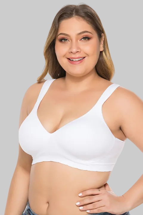 Woman wearing a white sports bra on a white background